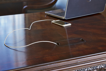 Biltmore desk from FFDM. It may be traditionally classy but it also comes with modern features to accommodate your gadget needs.