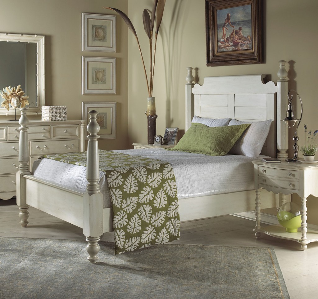 The Summer Home Collection of FFDM features this neutral colored bed and nature-inspired blanket. Notice how the blanket connects with the accent pillow, framed artworks, and the decorative piece underneath the bedside table.