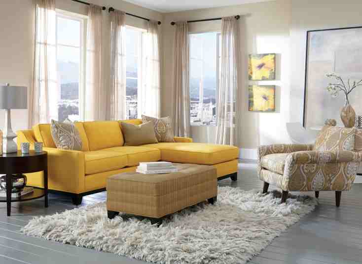 Jonathan Louis Norton Living Room Collection: This living room balances the vibrance of the bright colors and the subdued look offered by the neutral pieces.