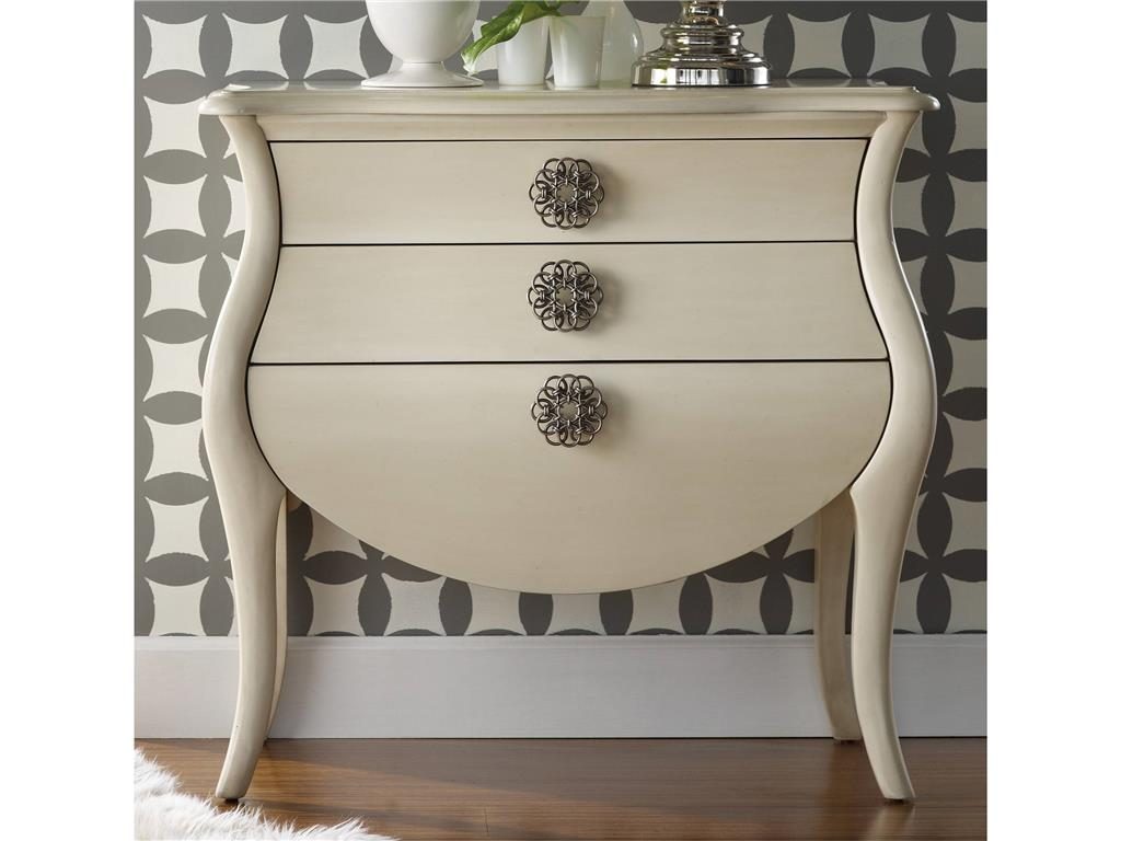 The patterned wallpaper at the back of the Hooker Furniture Living Room Pippa Bombe Chest 638-85079 offers an exquisite backdrop for this lovely accent piece.