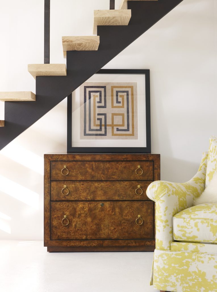 1586-10466A-BRN Epic Utility Credenza blends well with the yellow and white chair, the framed geometric art, and the black stairs.